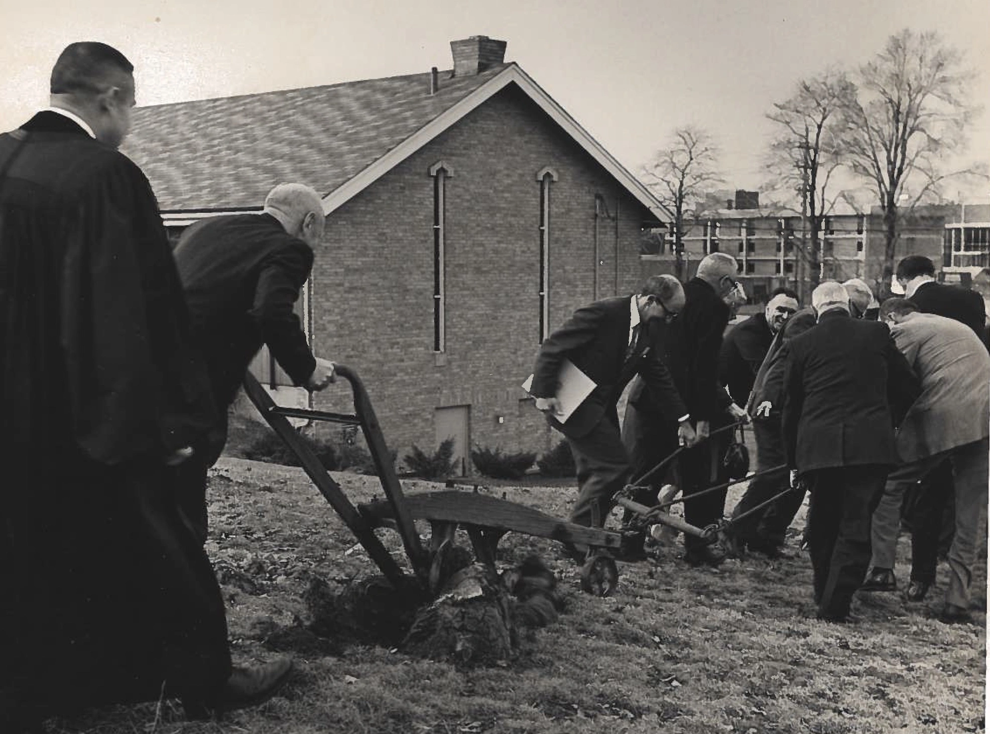 Having grown substantially, Kent Presbyterian Church needed to expand their building. This photo is taken showing members of the congregation and community breaking ground.